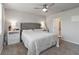 Cozy bedroom with plush carpet, ceiling fan, and neutral color scheme promotes rest and relaxation at 494 Amadoras Way, St Cloud, FL 34771