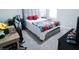 bedroom with full-size bed, desk, and ample floor space at 494 Amadoras Way, St Cloud, FL 34771
