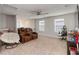 Large bonus room with neutral walls, plush carpeting, and a comfortable seating arrangement for ultimate relaxation at 494 Amadoras Way, St Cloud, FL 34771