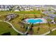 Community pool with lounge chairs and a covered patio area at 494 Amadoras Way, St Cloud, FL 34771