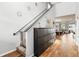 Hallway with dark wood floors and open access to the living room, dining room, and kitchen at 494 Amadoras Way, St Cloud, FL 34771