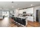Open kitchen featuring granite counters, stainless steel appliances, and a breakfast bar at 494 Amadoras Way, St Cloud, FL 34771