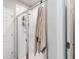 Clean, tiled shower featuring a glass door, rainfall shower head, and convenient built-in storage for toiletries at 494 Amadoras Way, St Cloud, FL 34771