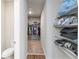Functional walk-in closet with shelves for bedding and clothing, and tile and carpet flooring at 494 Amadoras Way, St Cloud, FL 34771