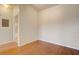 Simple bedroom with light walls and hardwood floors at 5961 Westgate Dr # 2034, Orlando, FL 32835