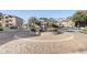 Community entrance with a circular fountain and landscaping at 5961 Westgate Dr # 2034, Orlando, FL 32835