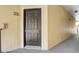 Apartment building entry with dark brown door and number 2034 at 5961 Westgate Dr # 2034, Orlando, FL 32835