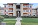 Two-story building exterior with balconies and landscaping at 5961 Westgate Dr # 2034, Orlando, FL 32835