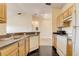 Kitchen with light wood cabinets and white appliances at 5961 Westgate Dr # 2034, Orlando, FL 32835