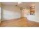 Open-concept living room with wood flooring and views to the kitchen at 5961 Westgate Dr # 2034, Orlando, FL 32835