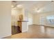 Open concept living room and kitchen with hardwood floors at 5961 Westgate Dr # 2034, Orlando, FL 32835