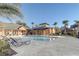Community pool with lounge chairs and surrounding landscaping at 5961 Westgate Dr # 2034, Orlando, FL 32835