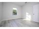 Bedroom with wood-look floors and a window at 6 Malauka Pass, Ocklawaha, FL 32179