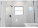 Clean shower with marble wall tiles and hexagonal floor tiles at 6 Malauka Pass, Ocklawaha, FL 32179