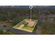 House highlighted in a neighborhood near a pond at 615 Tuskawilla Point Ln, Winter Springs, FL 32708