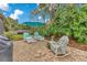 Charming backyard patio with lounge chairs and umbrella at 615 Tuskawilla Point Ln, Winter Springs, FL 32708