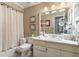 Clean bathroom with a tub shower combination, vanity, and linen storage at 615 Tuskawilla Point Ln, Winter Springs, FL 32708
