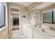 Double vanity bathroom with updated fixtures and natural light at 615 Tuskawilla Point Ln, Winter Springs, FL 32708