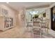 Cozy breakfast nook with glass-top table and built in shelving at 615 Tuskawilla Point Ln, Winter Springs, FL 32708
