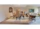 Bright dining area with glass-top table and neutral decor at 615 Tuskawilla Point Ln, Winter Springs, FL 32708