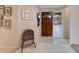 Inviting entryway with hardwood floors and charming vintage furniture at 615 Tuskawilla Point Ln, Winter Springs, FL 32708