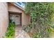 Front entry with white door, brick pathway, and lush greenery at 615 Tuskawilla Point Ln, Winter Springs, FL 32708