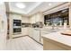 Bright kitchen features double oven, microwave, dishwasher, and ample cabinetry at 615 Tuskawilla Point Ln, Winter Springs, FL 32708