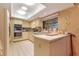 Well-lit kitchen with stainless steel appliances and ample counter space at 615 Tuskawilla Point Ln, Winter Springs, FL 32708