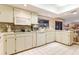 Well-lit kitchen with white cabinets, gas cooktop, and built-in appliances at 615 Tuskawilla Point Ln, Winter Springs, FL 32708