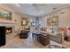 Cozy living room with fireplace, comfortable seating, and a plush rug at 615 Tuskawilla Point Ln, Winter Springs, FL 32708