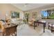 Home office featuring a large desk, comfortable seating, and natural light at 615 Tuskawilla Point Ln, Winter Springs, FL 32708