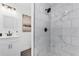 Modern bathroom with white marble tile shower and vanity at 720 Jasmine Ave, Orange City, FL 32763
