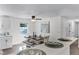 Dining room featuring a modern table setting, stylish ceiling fan, and bright natural light at 720 Jasmine Ave, Orange City, FL 32763