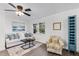 Bright living room featuring stylish decor and neutral walls and updated flooring at 720 Jasmine Ave, Orange City, FL 32763