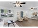 Sunlit living room featuring hard surface floors and neutral paint with updated furnishings at 720 Jasmine Ave, Orange City, FL 32763