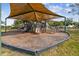 Covered playground with various play structures for children at 734 Rainfall Dr, Winter Garden, FL 34787