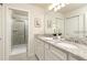 Bathroom with double vanity, granite countertop, and shower at 7530 Oak Spring Ln, Davenport, FL 33837