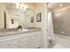 Modern bathroom with double vanity and shower/tub combo at 7530 Oak Spring Ln, Davenport, FL 33837