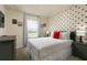 Mickey Mouse-themed bedroom with double bed, dresser, and window at 7530 Oak Spring Ln, Davenport, FL 33837