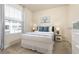 Bedroom with double bed, window, and nightstands at 7530 Oak Spring Ln, Davenport, FL 33837