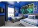 Twin bedroom with blue walls and tree tapestry at 7530 Oak Spring Ln, Davenport, FL 33837