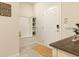 Bright and airy entryway with built-in bench and storage at 7530 Oak Spring Ln, Davenport, FL 33837