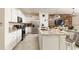 Modern kitchen with white cabinets and island at 7530 Oak Spring Ln, Davenport, FL 33837