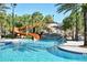 Resort-style pool with a waterslide and waterfall feature at 7530 Oak Spring Ln, Davenport, FL 33837