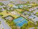 Aerial view of tennis courts, playground, and community green spaces at 7783 Westland Dr, Kissimmee, FL 34747