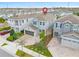 Aerial view of a two-story house with a two-car garage, located in a residential neighborhood at 7783 Westland Dr, Kissimmee, FL 34747