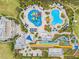 Aerial view of resort-style amenities, including pools, waterslides, and expansive green spaces at 7783 Westland Dr, Kissimmee, FL 34747