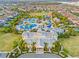 Aerial view of community with water park and clubhouse at 7783 Westland Dr, Kissimmee, FL 34747