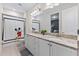 Bathroom with granite countertops, double sinks, and Mickey Mouse theme at 7783 Westland Dr, Kissimmee, FL 34747