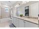 Bathroom with granite countertops, double sinks, and tub at 7783 Westland Dr, Kissimmee, FL 34747